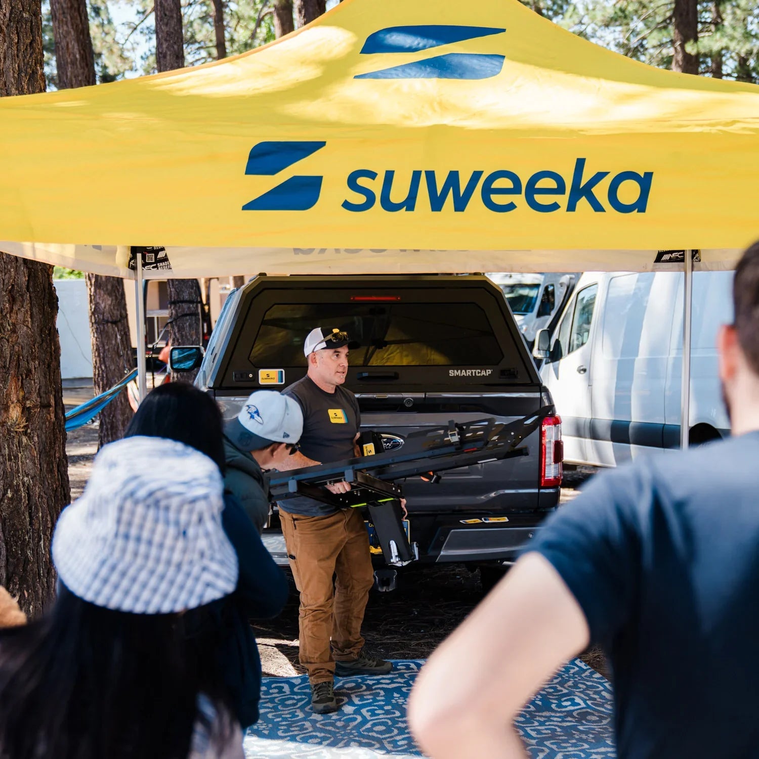 Founder Spencer Houser showing The Lifter at an outdoor event