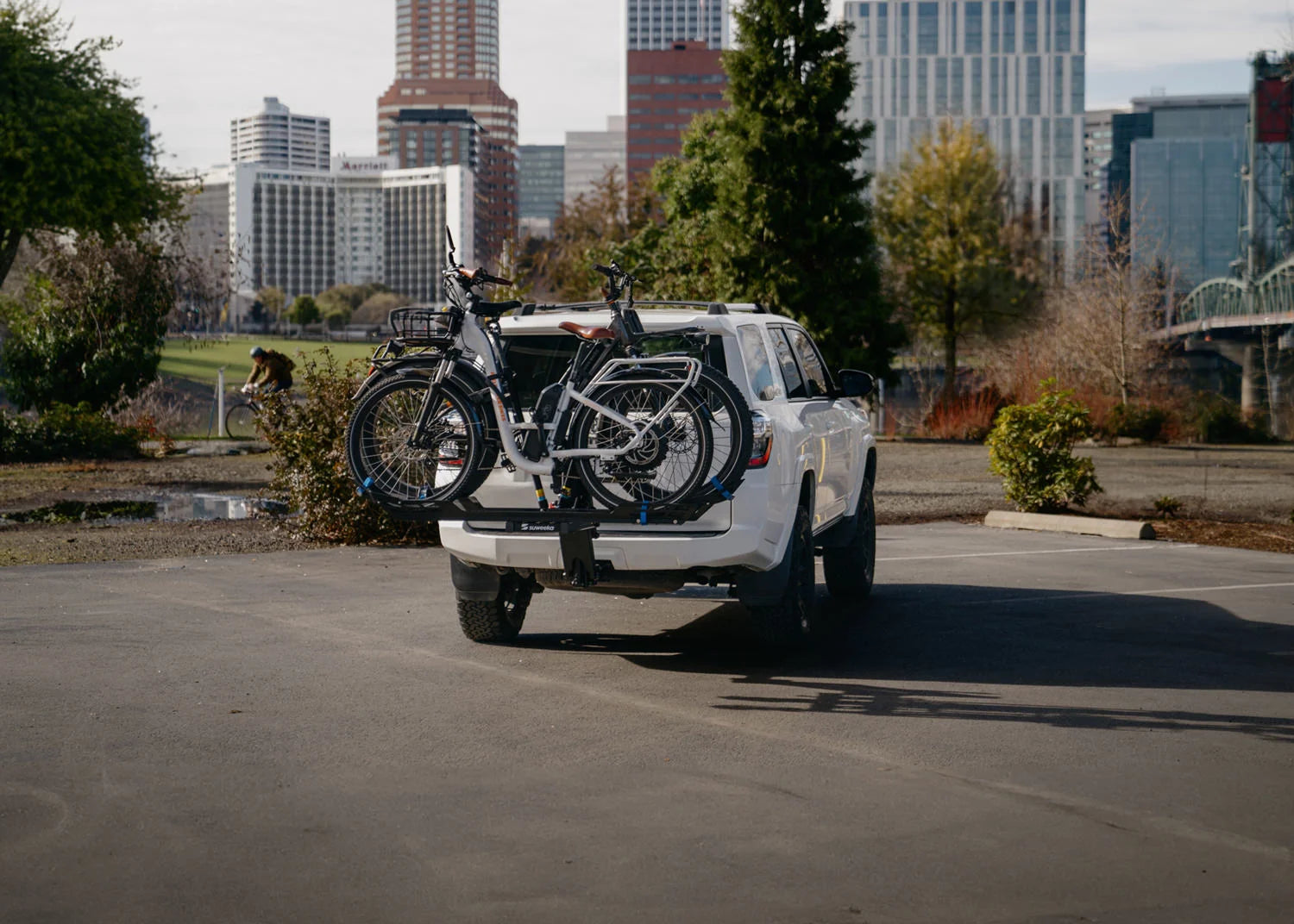The Lifter rack with two bikes, in Portland with view of the skyline
