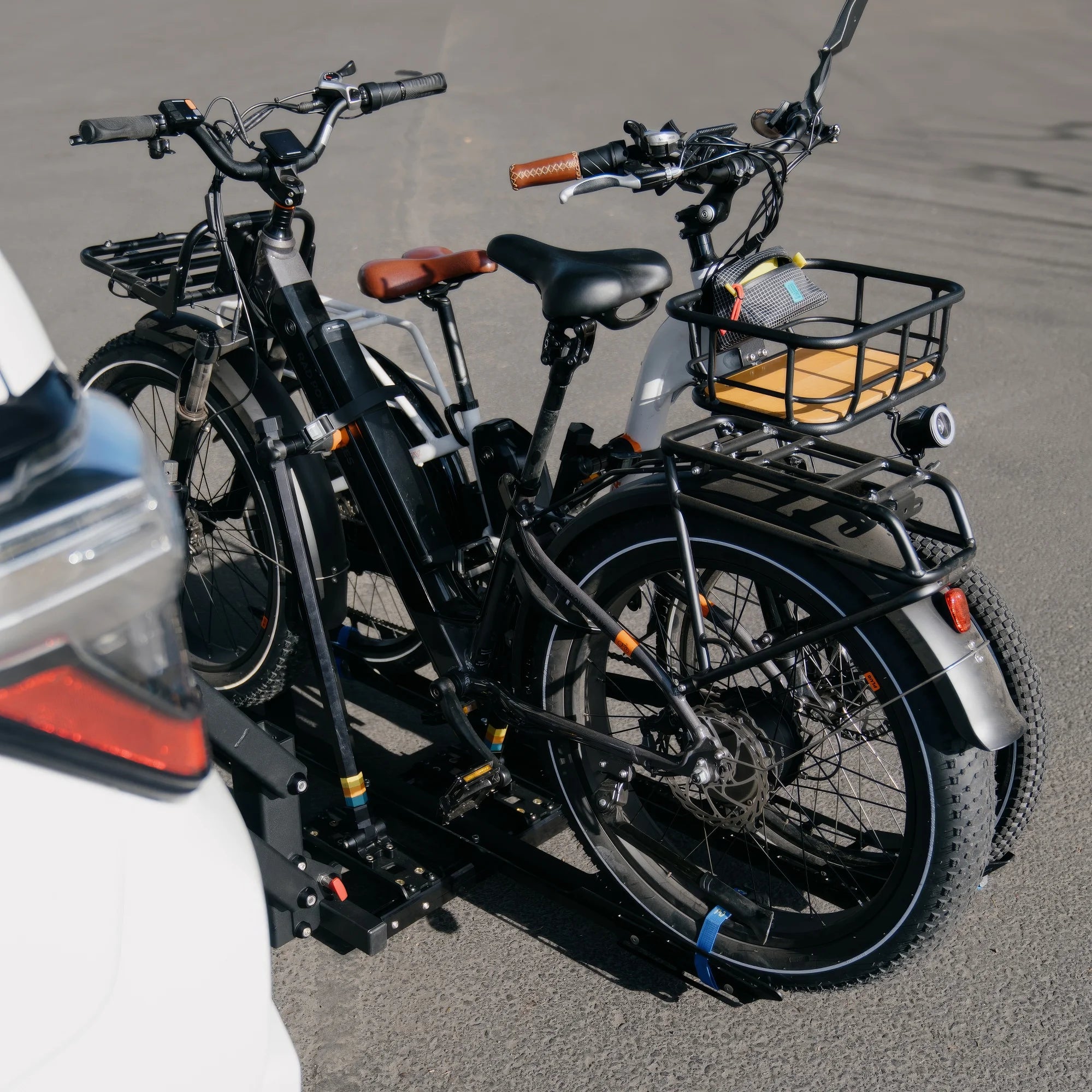 Two heavy e-Bikes lowered to the ground on The Lifter rack